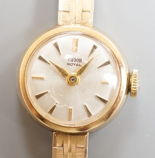 A lady's 9ct gold Tudor Royal manual wind wrist watch, on a 9ct gold bracelet with Rolex crown insignia on clasp, case diameter 18mm, gross weight 16.7 grams, no box or papers.